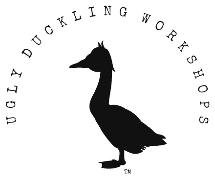 Ugly Duckling Workshops seal: the duck beneath the arched words Ugly Duckling Workshops